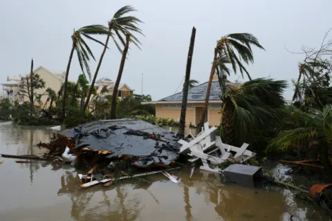 Bahamas hurricane survivors tell of children swept away; death toll climbs
