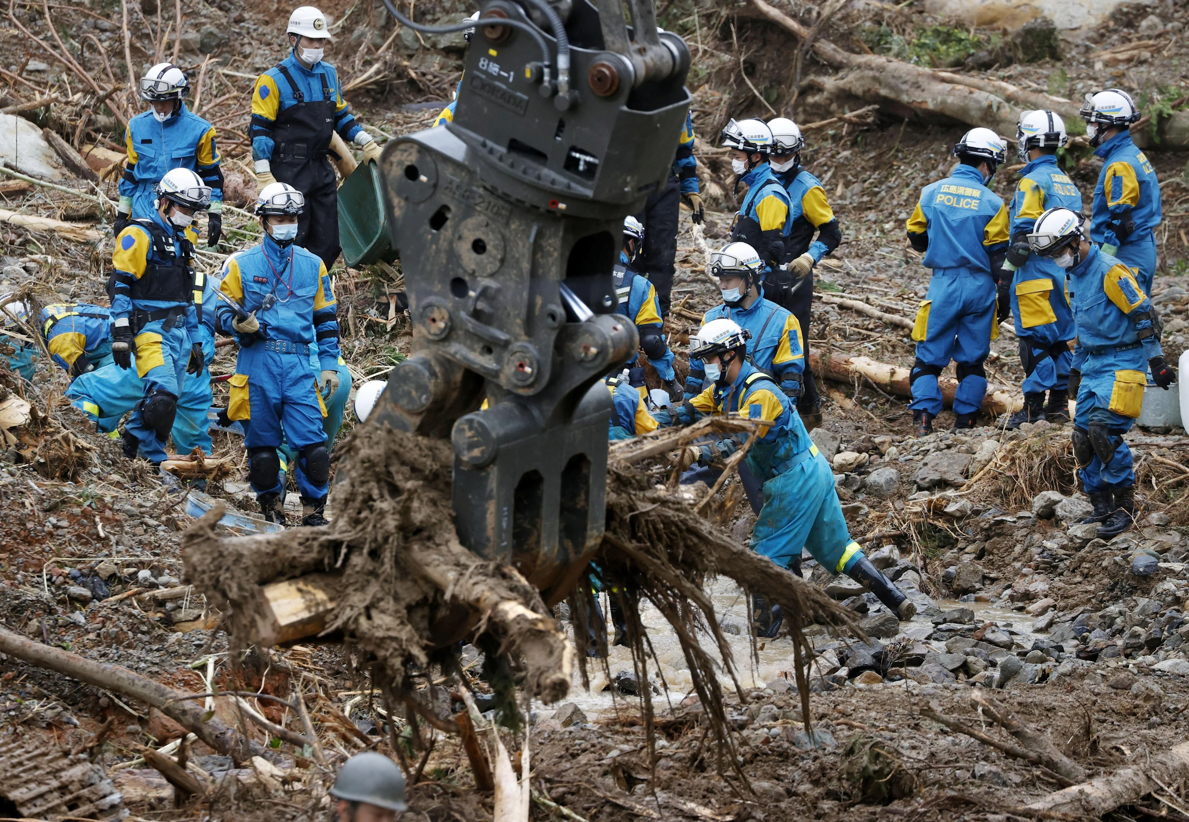 REUTERS: Rescue workers search for missing people at a landslide site caused by torrential rain in Tsunagi town, Kumamoto Prefecture, southwestern Japan in this photo taken by Kyodo, on July 6, 2020. Mandatory credit Kyodo/via REUTERS