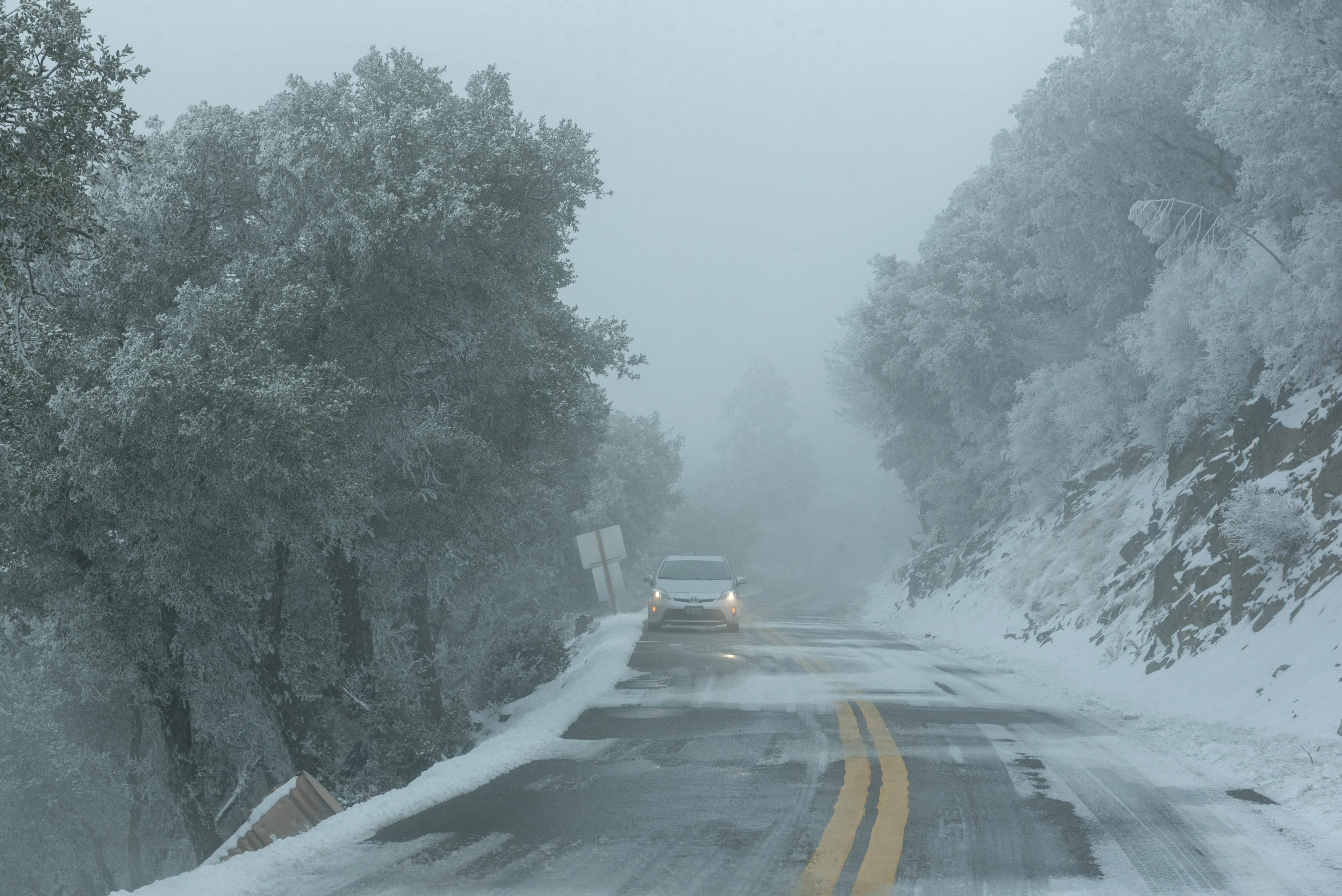 REUTERS: View of an icy road as a massive winter storm passes along the West coast, on Mount Hamilton near San Jose, California, U.S., February 23, 2023. REUTERS/Laure Andrillon