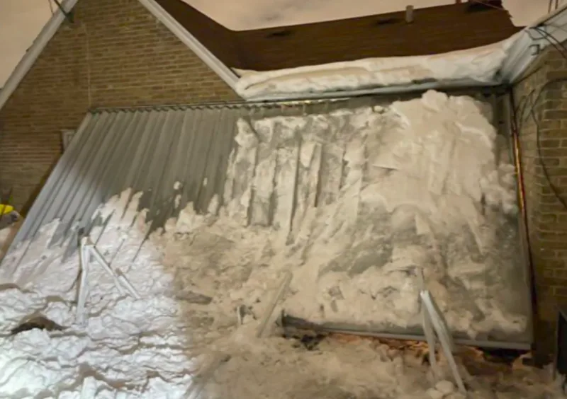 Woman trapped for hours beneath collapsed snow-laden canopy