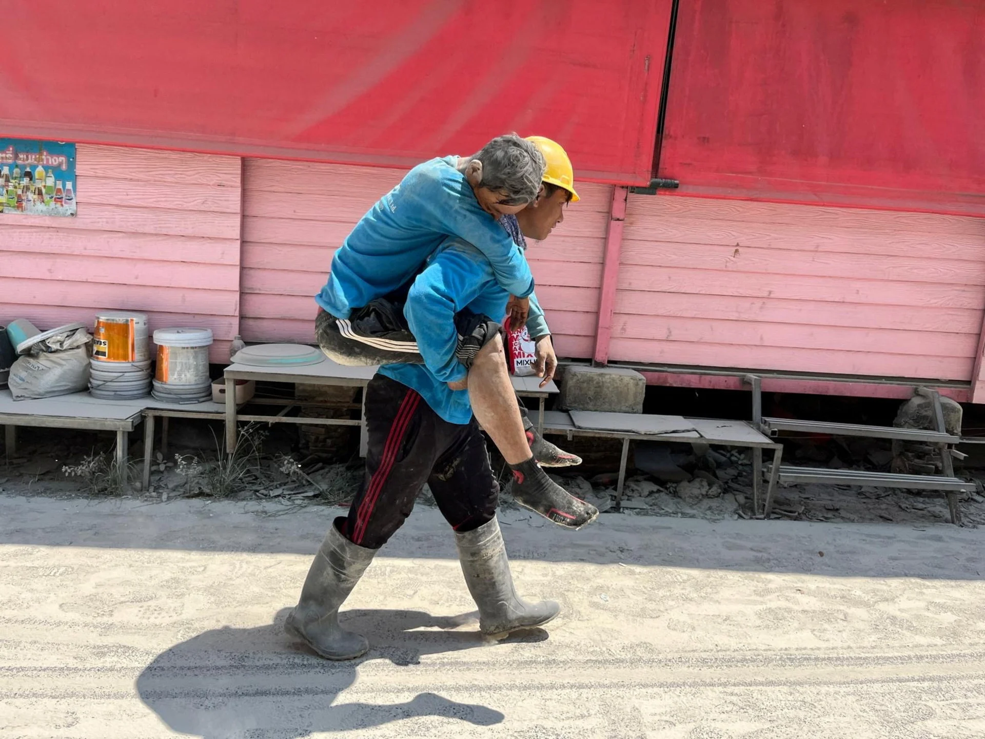 Reuters: A worker carries a casualty on his back after a strong earthquake struck central Myanmar on Friday, earthquake monitoring services said, which affected Bangkok as well with people pouring out of buildings following the tremors in the Thai capital, in Bangkok, Thailand, March 28, 2025. REUTERS/Ann Wang
