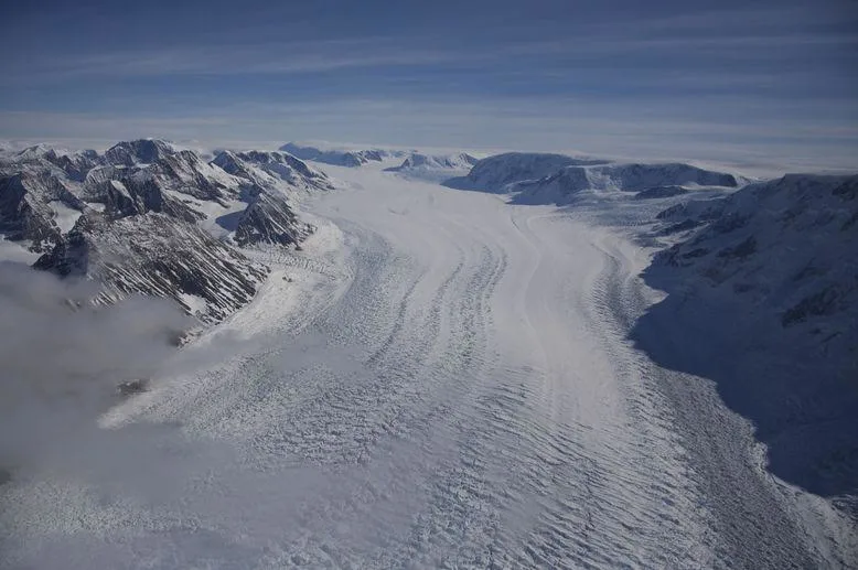 the conversation - An Antarctic glacier flows toward the sea. (Erin Pettit)