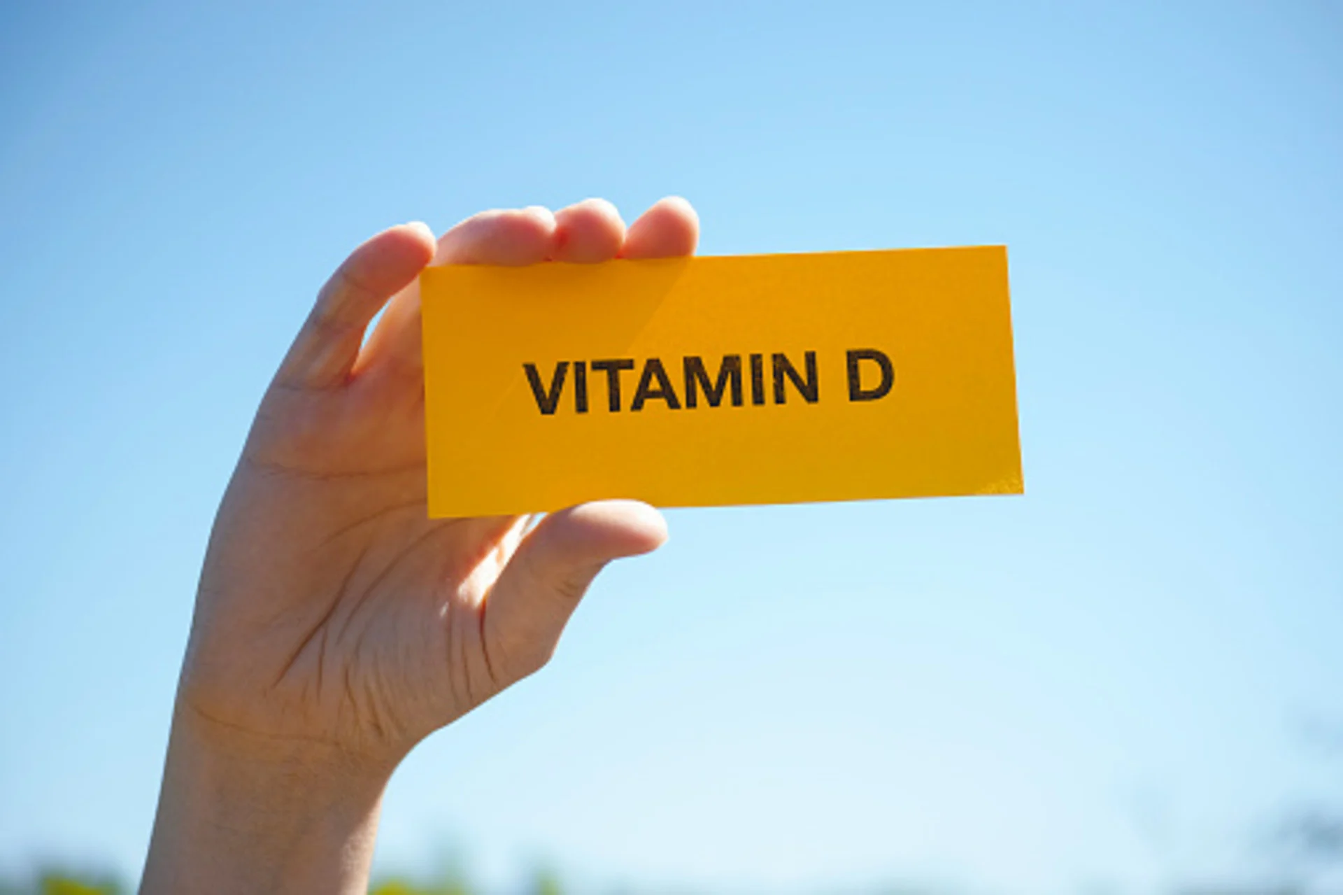 Getty Images: Hand holds piece of paper with Vitamin D against sunny blue sky. Close up. Credit info: Credit: Professor25 Creative #: 965014868 License type: Royalty-free Collection: iStock / Getty Images Plus. Link: https://www.gettyimages.ca/detail/photo/hand-holds-piece-of-paper-with-vitamin-d-against-royalty-free-image/965014868?phrase=vitamin+d&adppopup=true