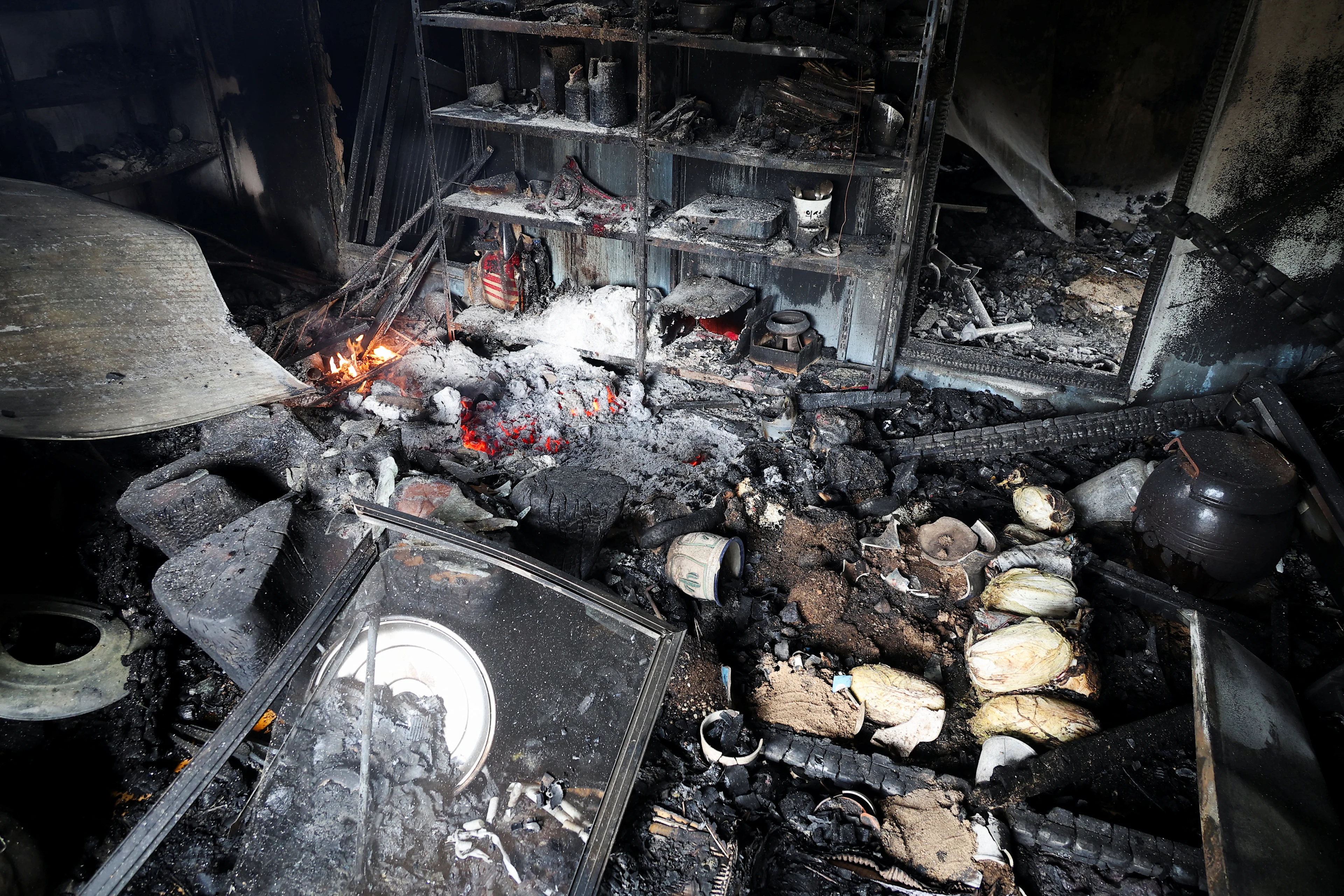 REUTERS: Burnt and damaged items lie at property after a wildfire devastated the area, in Uiseong, South Korea March 27, 2025.REUTERS/Kim Hong-Ji