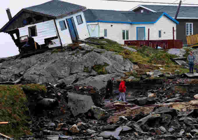 Persons head to their homes in the aftermath of Hurricane Fiona in Burnt Islands, Newfoundland, Canada September 27, 2022. (REUTERS/John Morris)