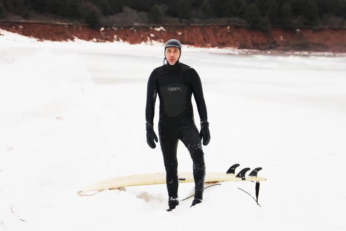 (CBC) Surfer in Prince Edward Island March 2024