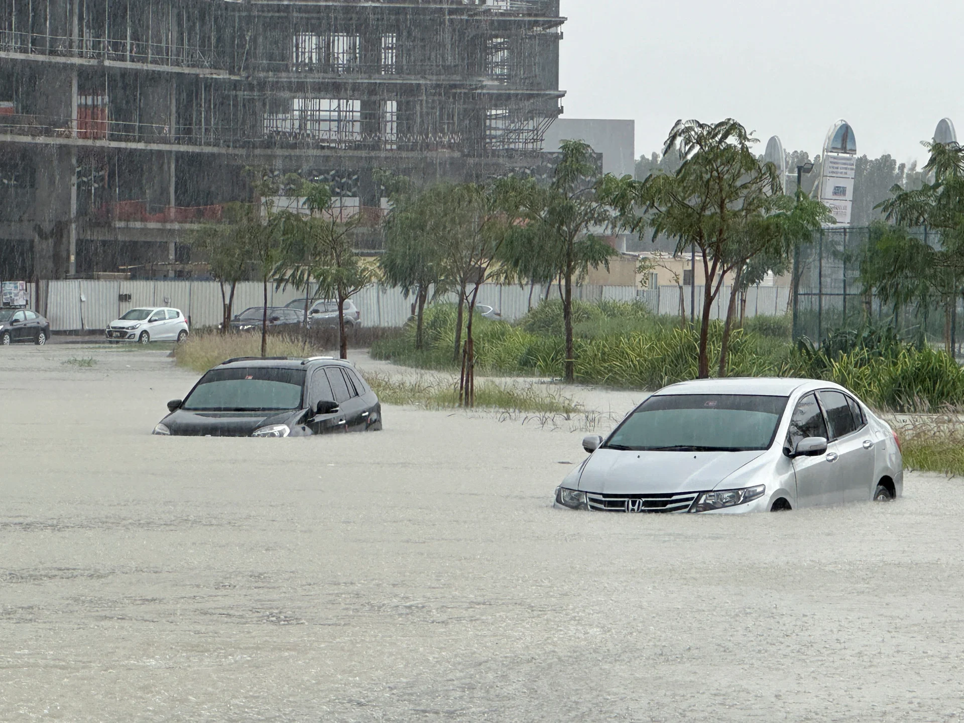 Reuters: Cars drive through a flooded street during a rain storm in Dubai, United Arab Emirates, April 16, 2024. REUTERS/Abdel Hadi Ramahi