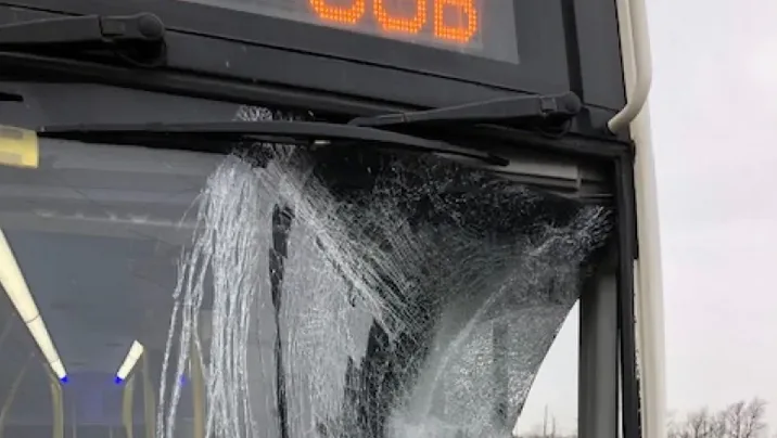 Ice flies off transport truck on 401, shatters GO bus window