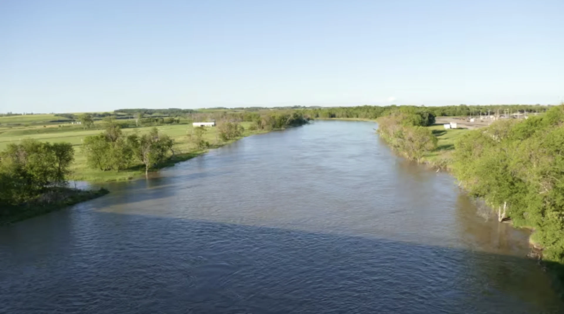 CBC: The Assiniboine River in Brandon, Man., is seen in a file image. A stretch of the river, between the Shellmouth Dam and the city, is under a flood warning. (Riley Laychuk/CBC)
