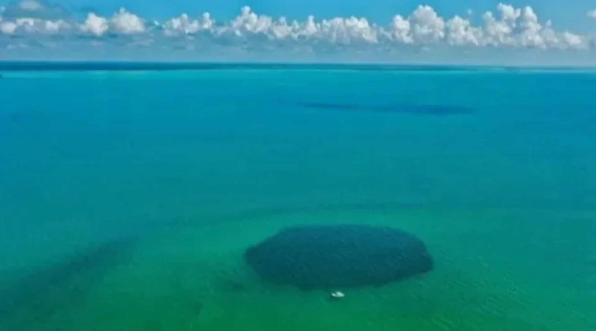 Watch as a huge sinkhole swallows the middle of a soccer field - The