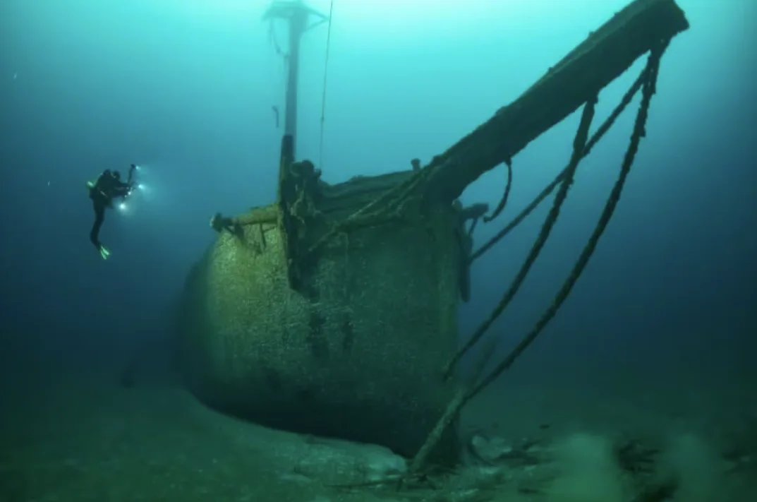 CBC: A diver takes a series of images of a sunken vessel in an unknown lake using a technique called photogammetry, which uses many pictures taken at different angles to create an accurate 3D model of shipwrecks. (3Dshipwrecks.org)
