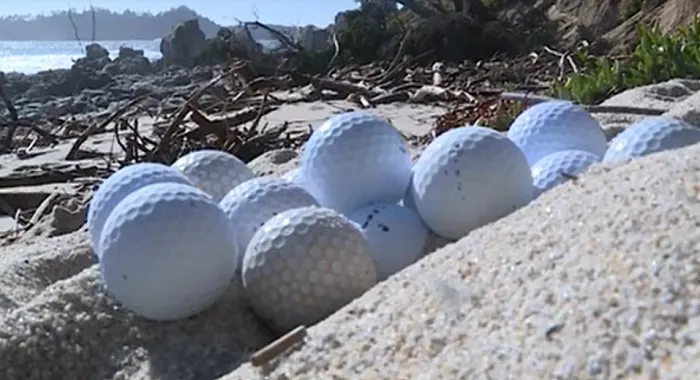 Thousands of golf balls wash ashore following series of winter storms