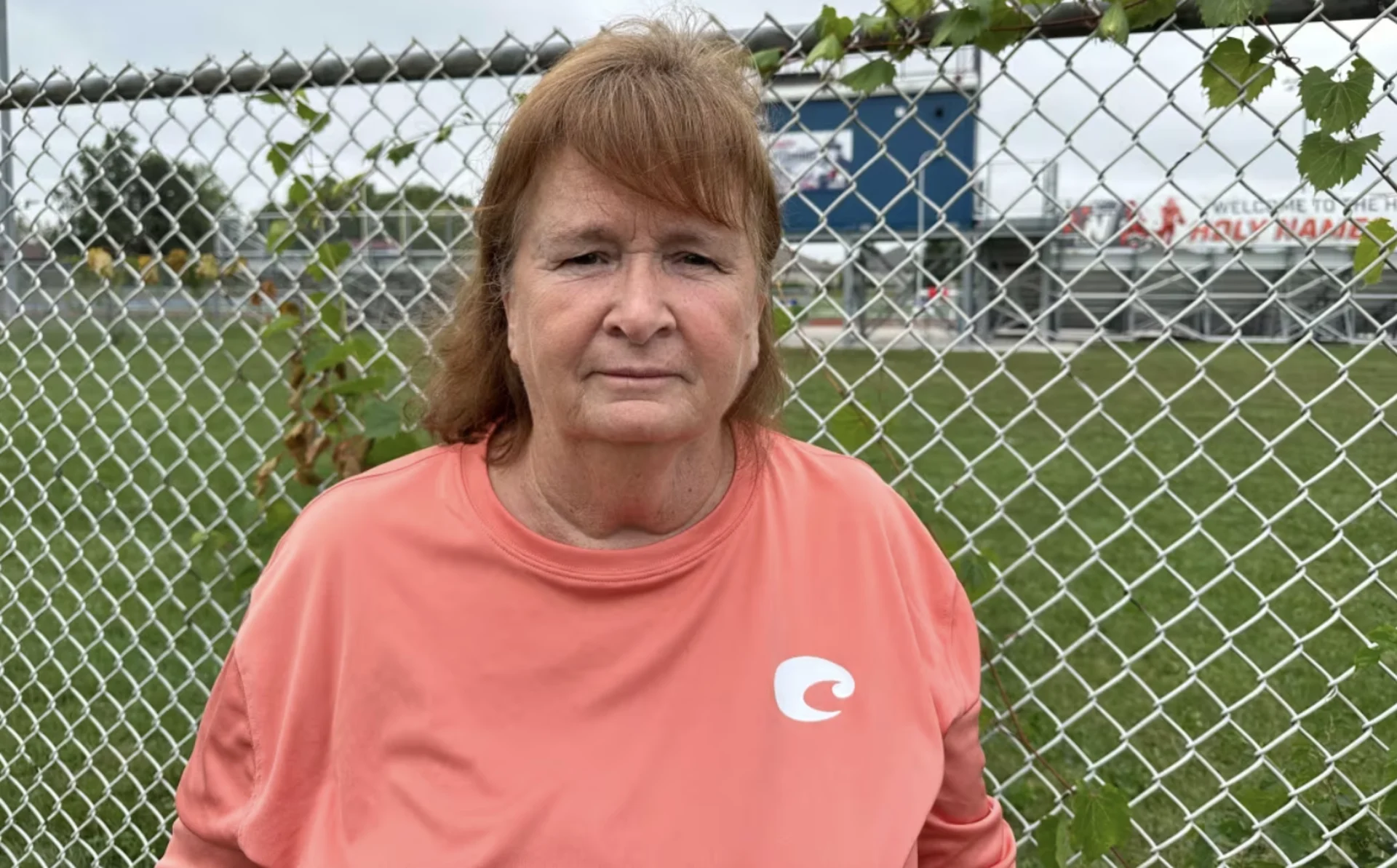 CBC: Catherine Archer near the football field at Holy Names Catholic High School in south Windsor, where she saw and killed a spotted lanternfly specimen. (Dalson Chen/CBC)