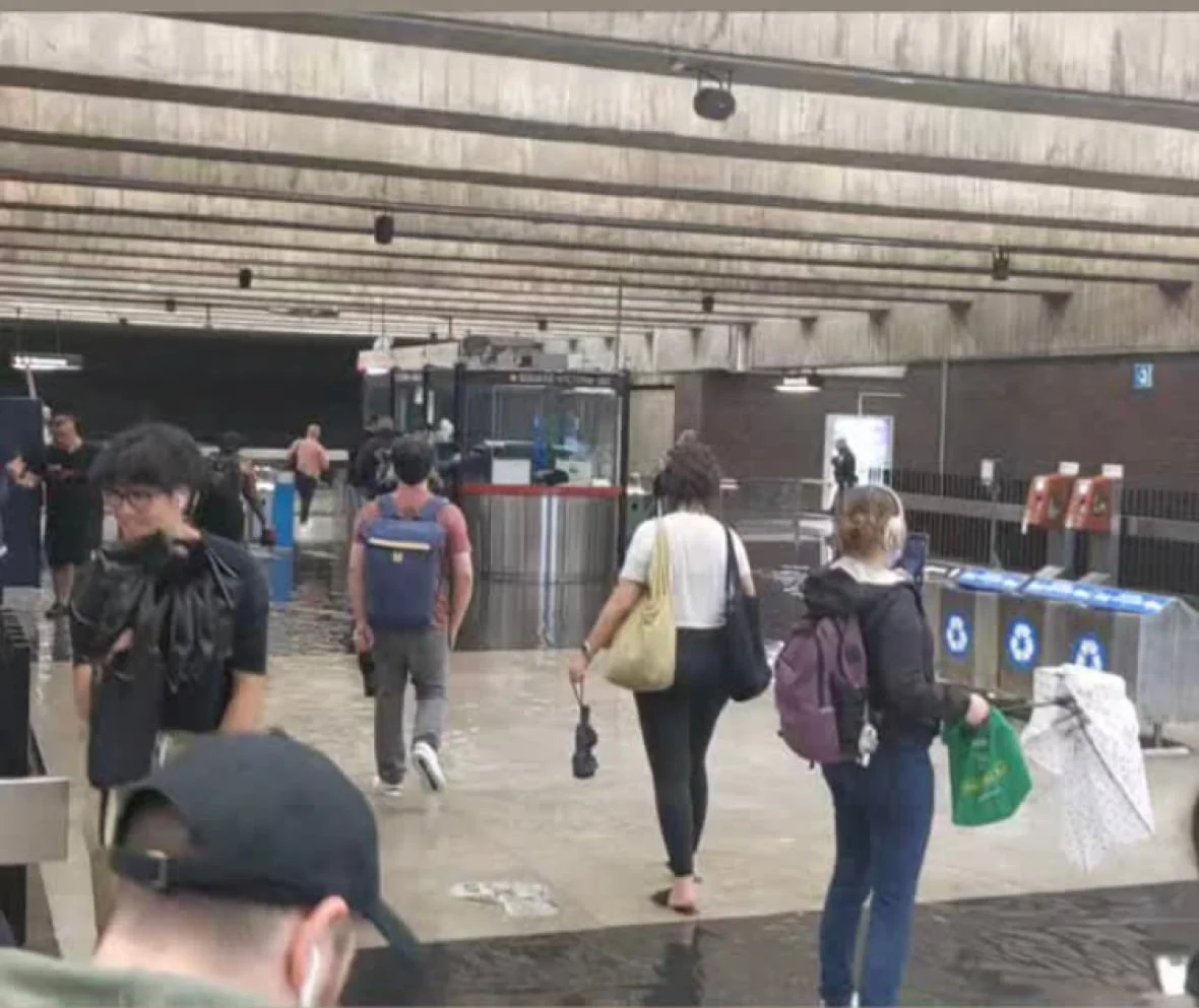 montreal-commuters-in-flood-metro-station
