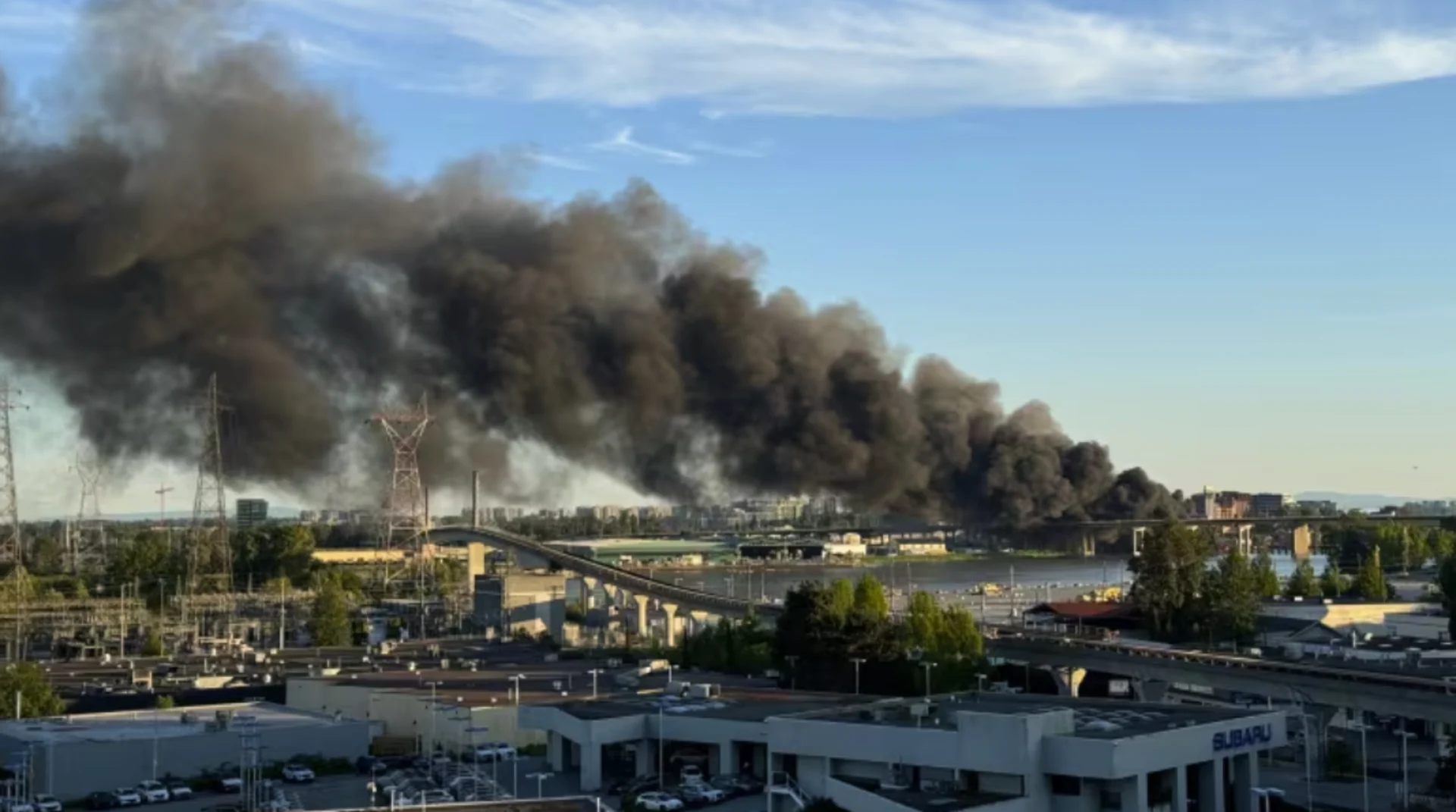 Large fire breaks out near Oak Street Bridge in Richmond, B.C., impacting travel and air quality. See what happened, here