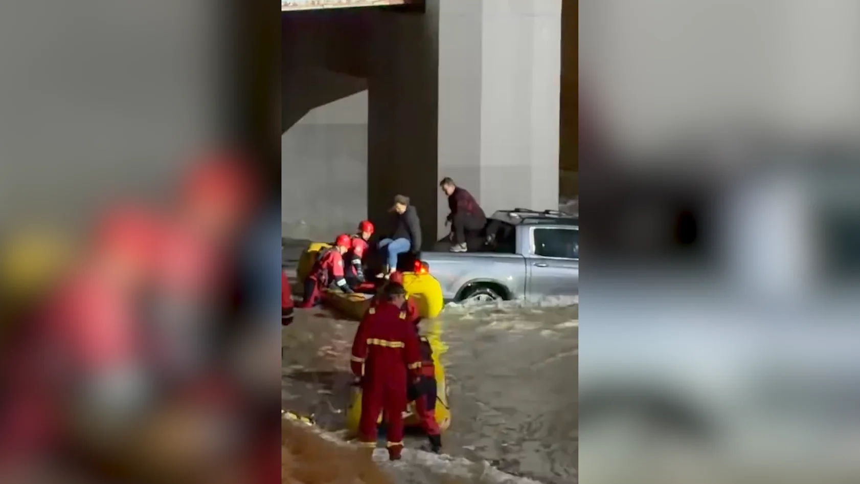 (UGC) People being rescued from a truck stuck in floodwaters on Calgary highway Dec. 31, 2025
