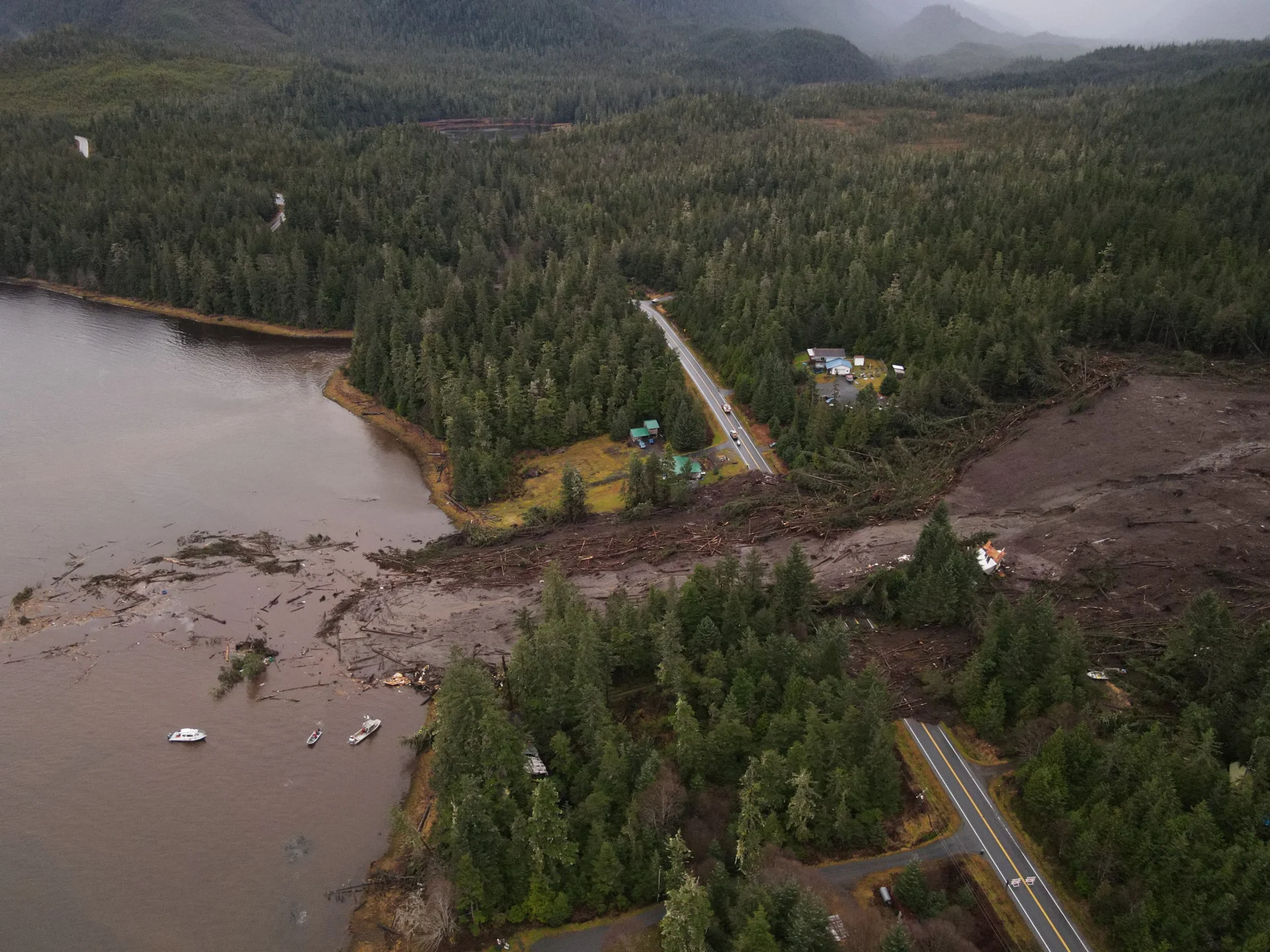 Reuters: An aerial view of mud and forest debris that buried a stretch of the Zimovia Highway a day after a landslide struck an area of Wrangell, Alaska, U.S., November 21, 2023. Alaska Department of Transportation and Public Facilities/Handout via REUTERS