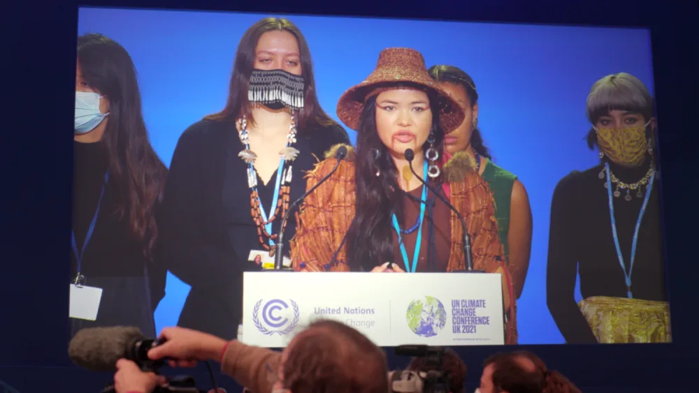 At COP26, Takaiya Blaney, a member of the Tla’Amin First Nation, speaks about the harm of resource extraction in Canada. (Indigenous Climate Action)