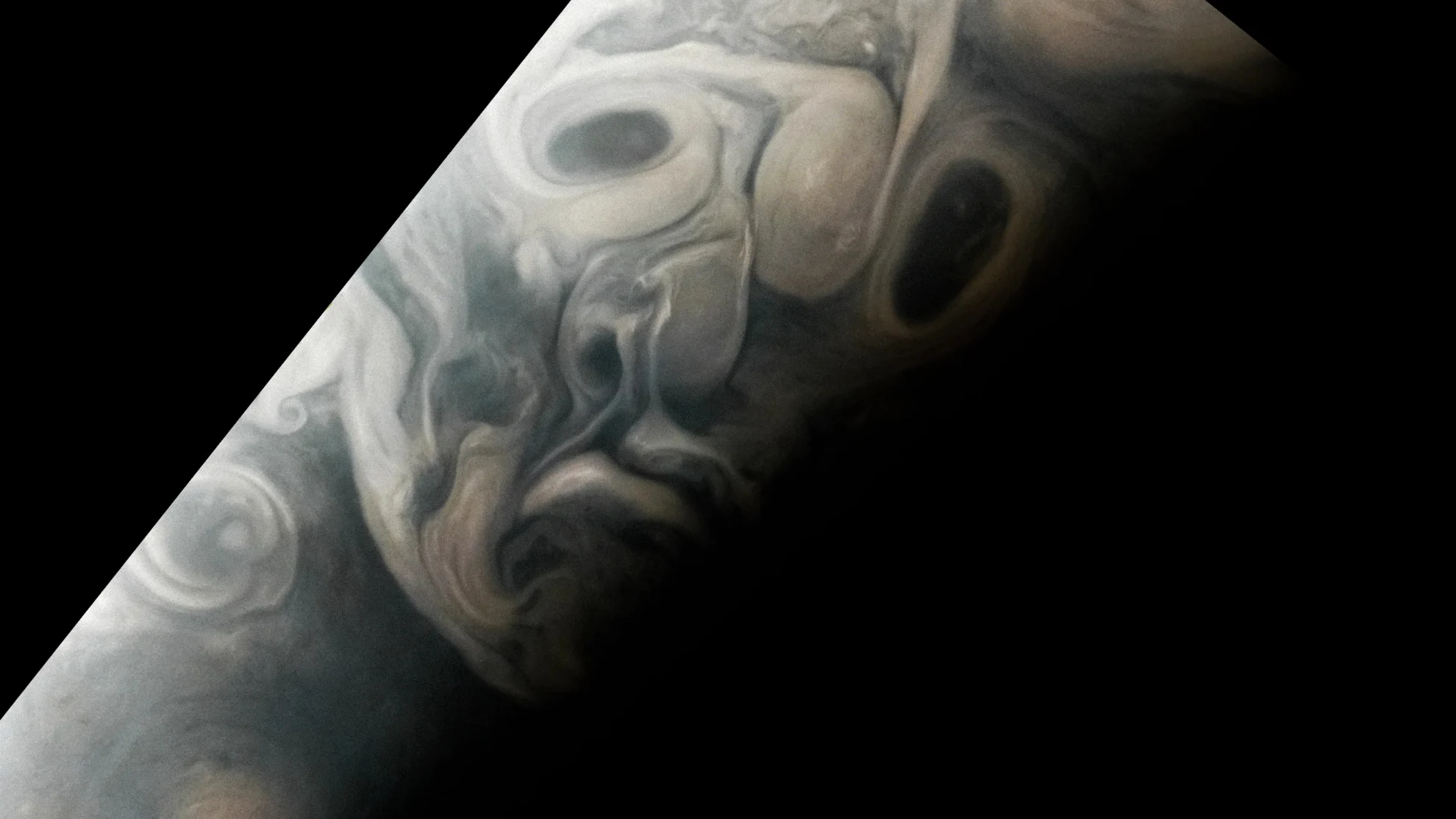 Spooky Jupiter Face Seen in Clouds by NASA Juno Perijove 54