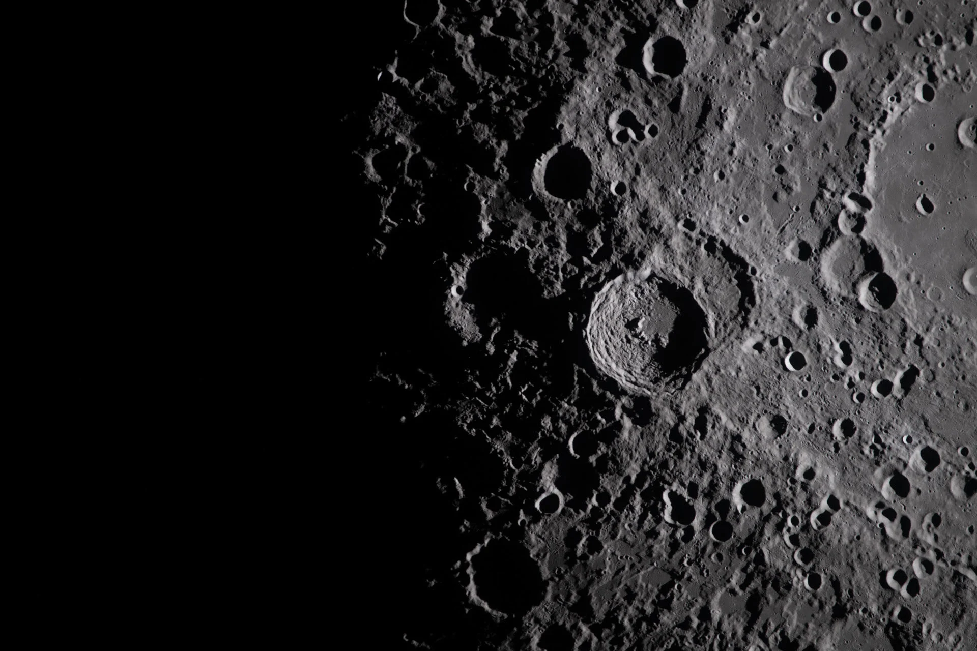 Overlapping craters along the lunar terminator - Artemis 2 - ART002-E-20764