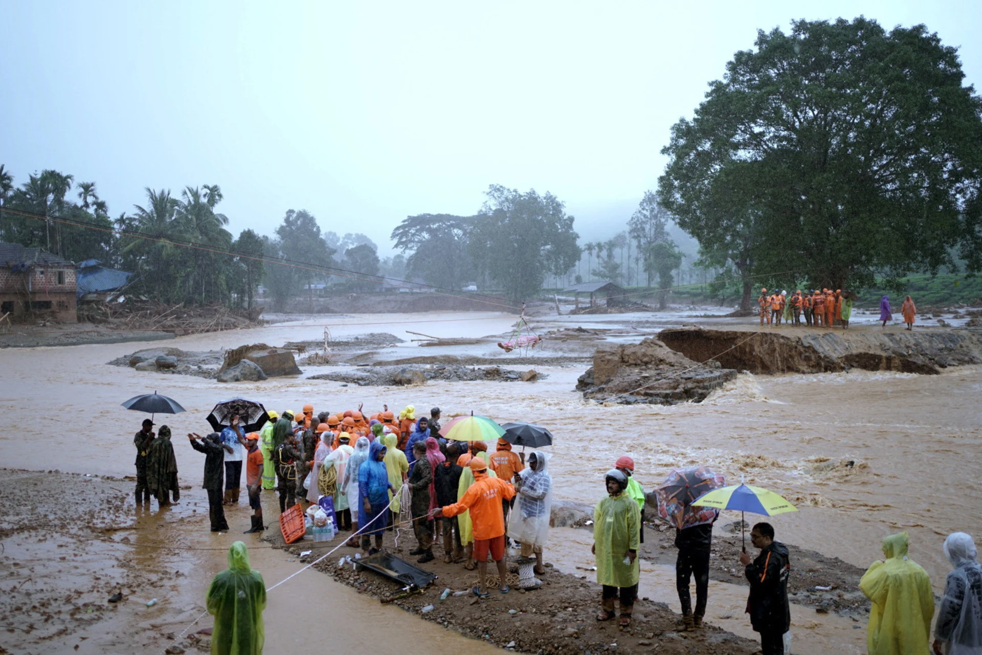 Reuters: Members of rescue teams conduct rescue operation at a landslide site after multiple landslides in the hills in Wayanad, in the southern state of Kerala, India, July 30, 2024. REUTERS/CK Thanseer