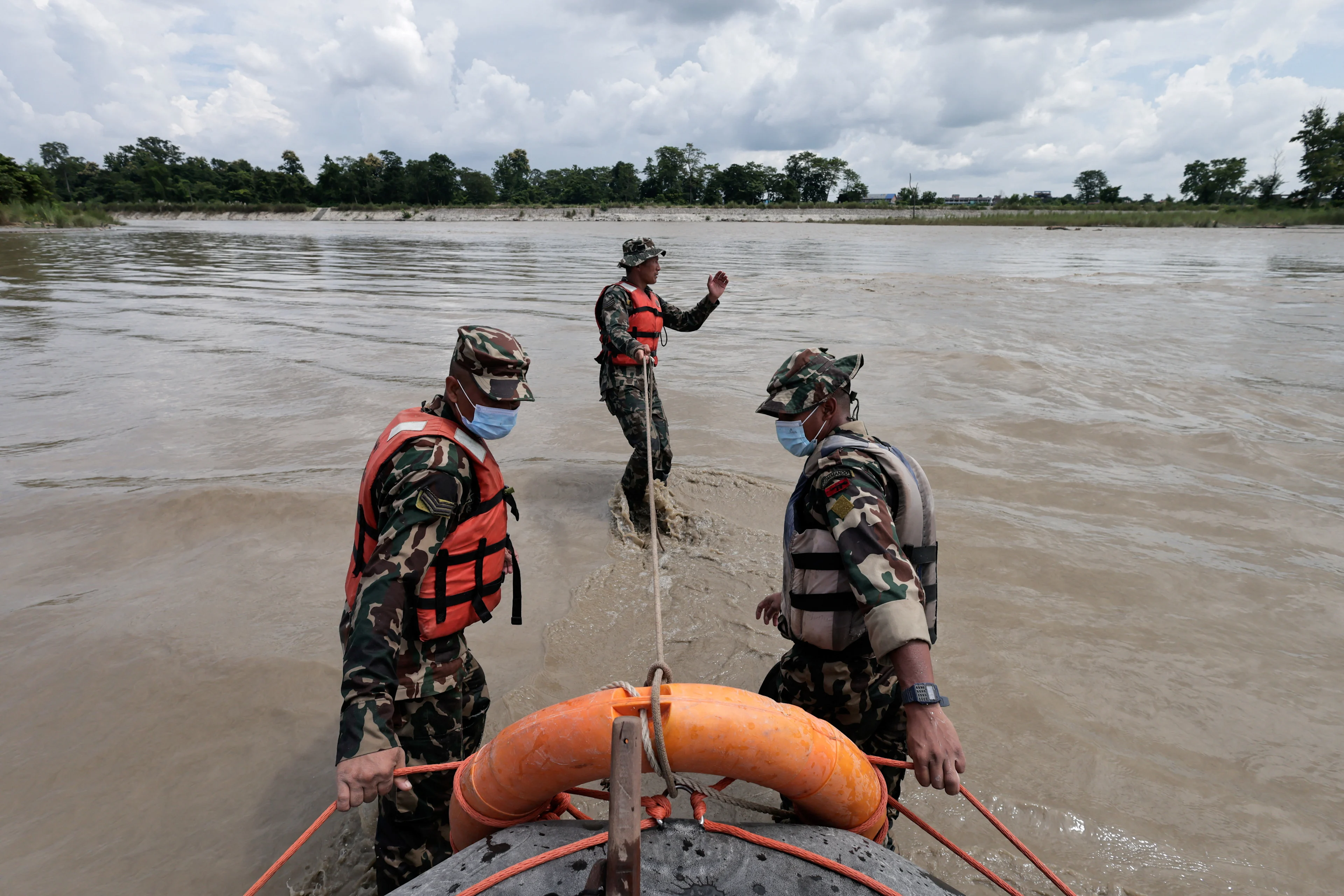 REUTERS: Members of the Nepal Army conduct a search operation for bodies washed away by flash floods and a mudslide in the Narayani River, Chitwan, Nepal, August 31, 2026. REUTERS/Navesh Chitrakar