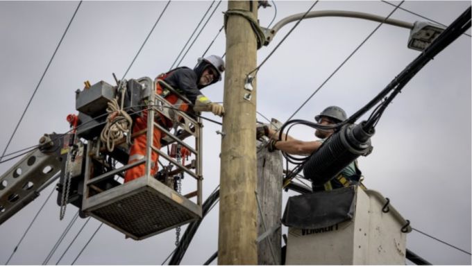 CBC: Bell crews and contractors are seen repairing and installing communication cables in Cape Breton in the aftermath of Hurricane Fiona. (Robert Short/CBC)