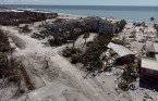 Hurricane-ravaged Florida, Carolinas face daunting recovery from Ian