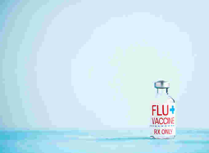 GETTY IMAGES: Flu vaccine shot. (https://www.gettyimages.ca/detail/photo/vial-with-flu-vaccine-and-copy-space-royalty-free-image/1050993716?adppopup=true)