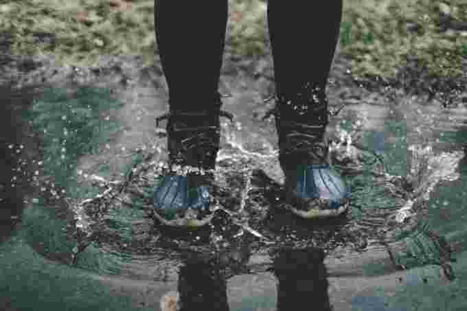 Rain boots puddle unsplash Zach Reiner