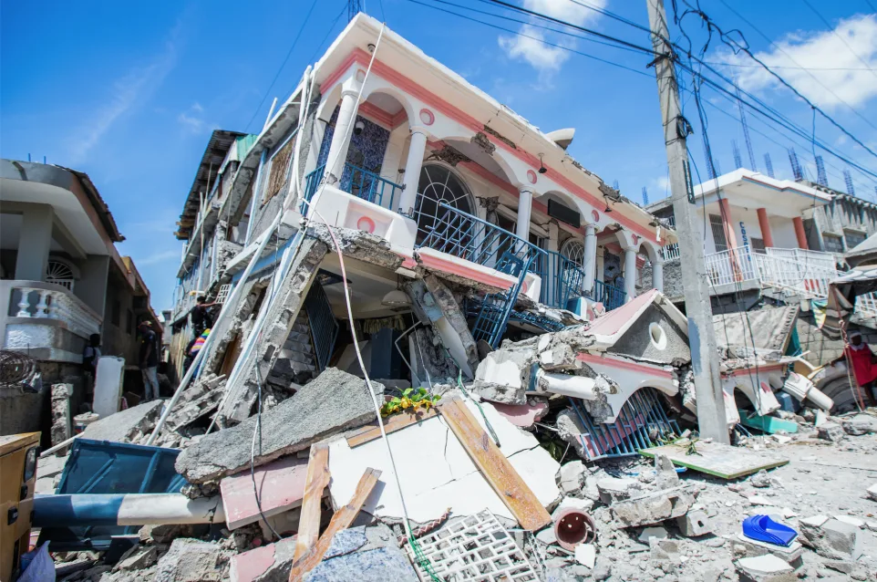 REUTERS: A view shows houses destroyed following a 7.2 magnitude earthquake in Les Cayes, Haiti August 14, 2021. REUTERS/Ralph Tedy Erol NO RESALES. NO ARCHIVES