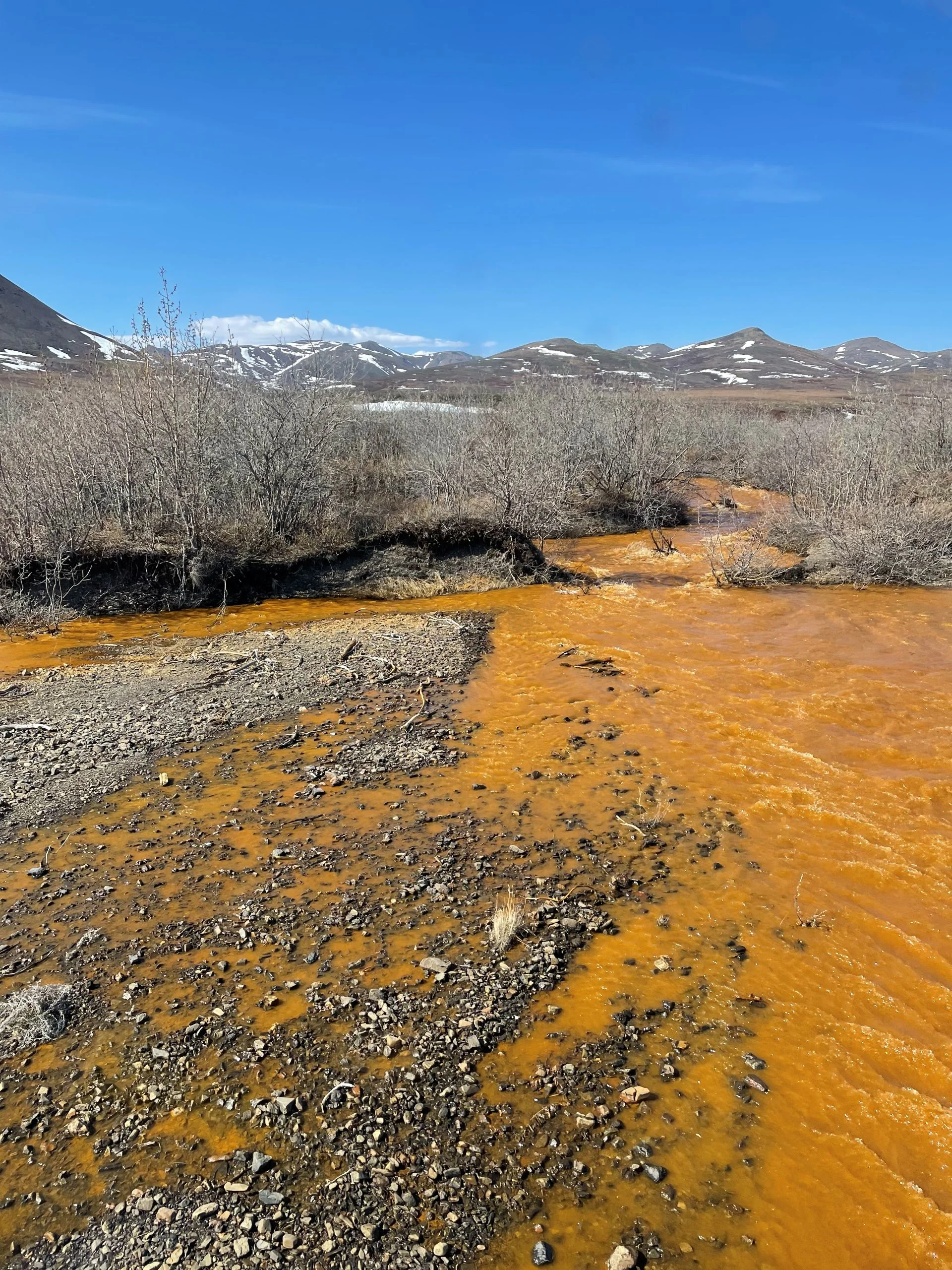Orange water from a tributary of the Kugororuk River in Alaska/Josh Koch/U.S. Geological Survey