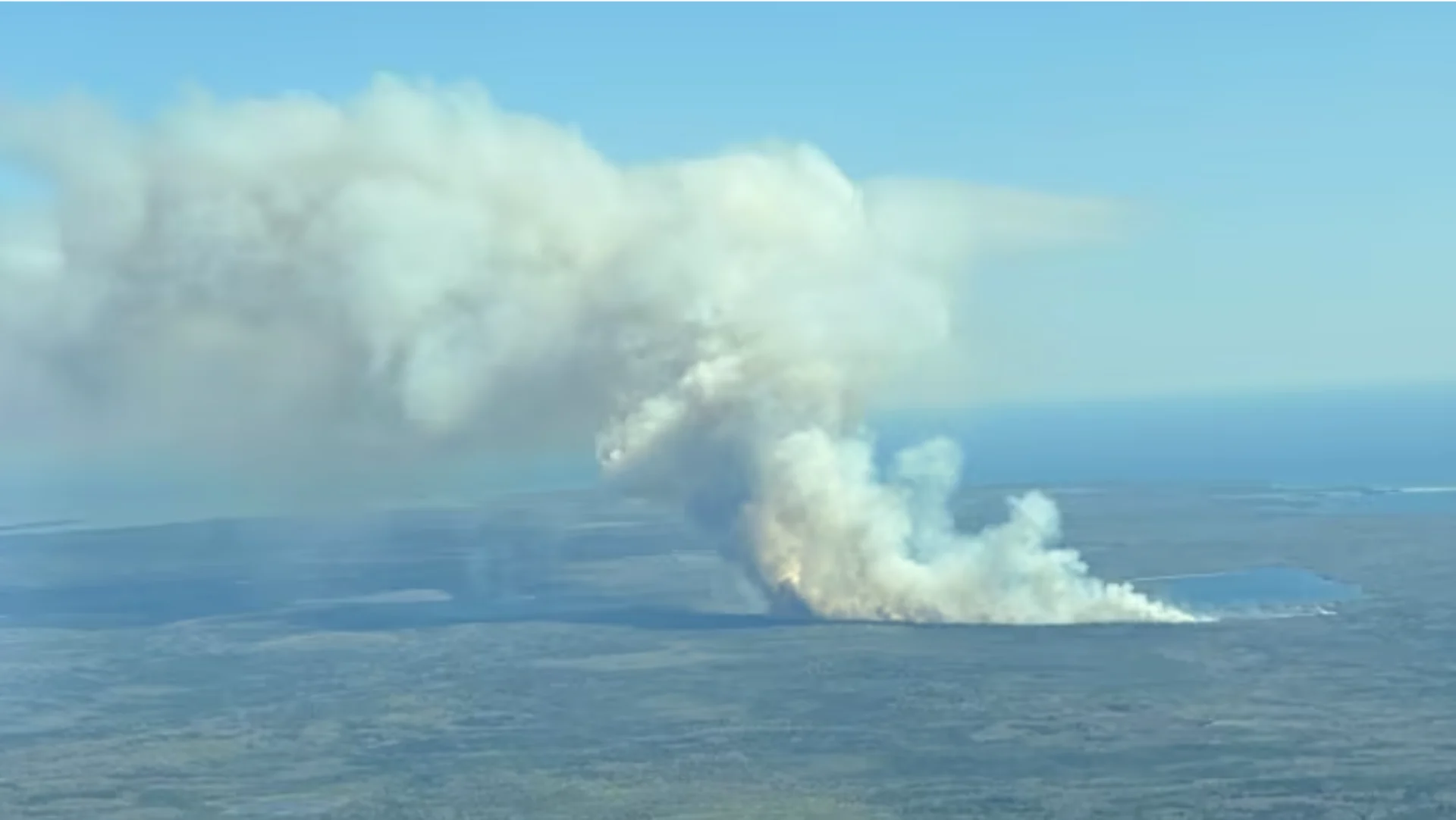 CBC: An aerial photo shows smoke and fire near Barrington Lake in Shelburne County. (NS Department of Natural Resources)