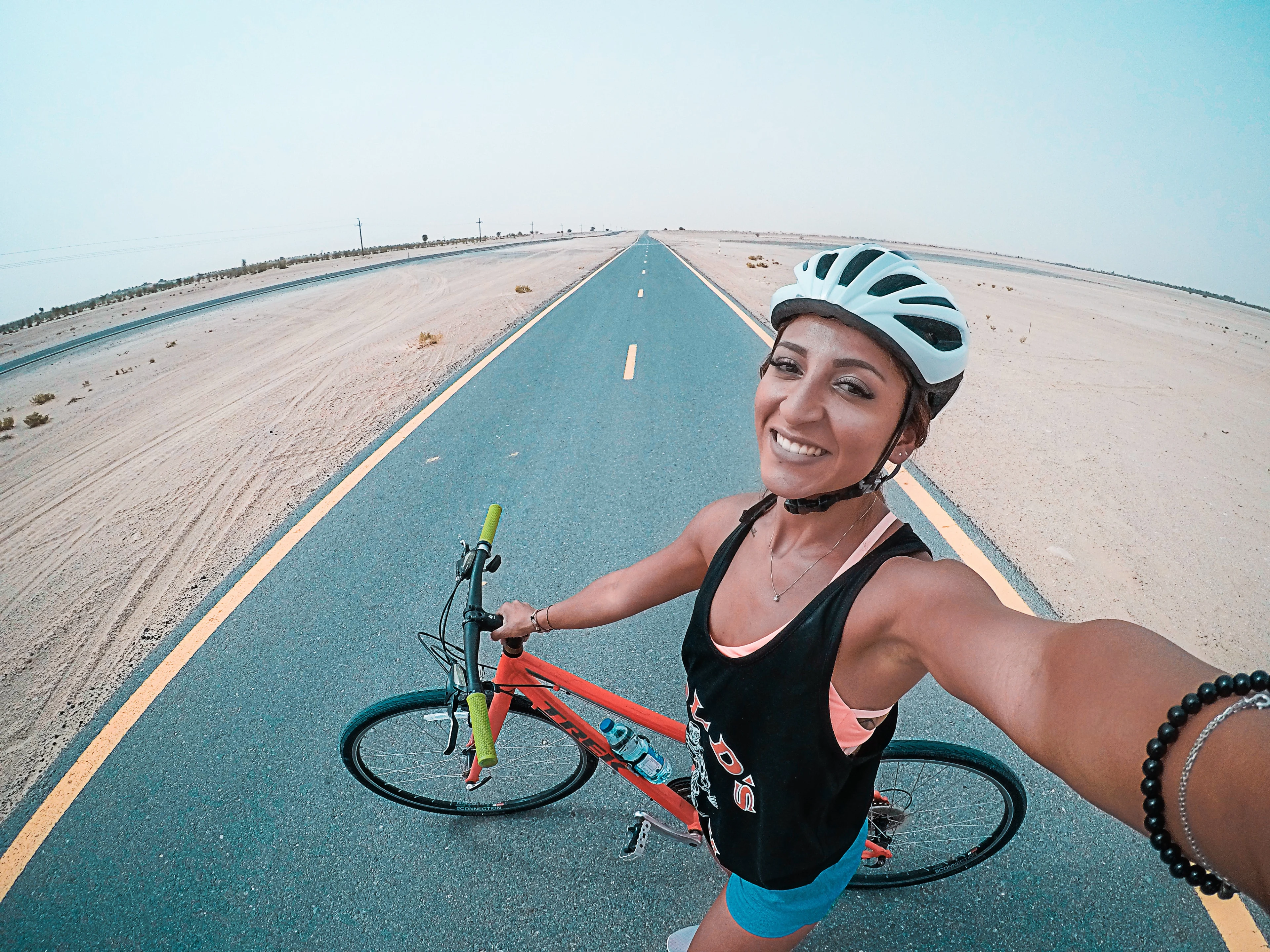 Bike rider takes selfie in the middle of the road