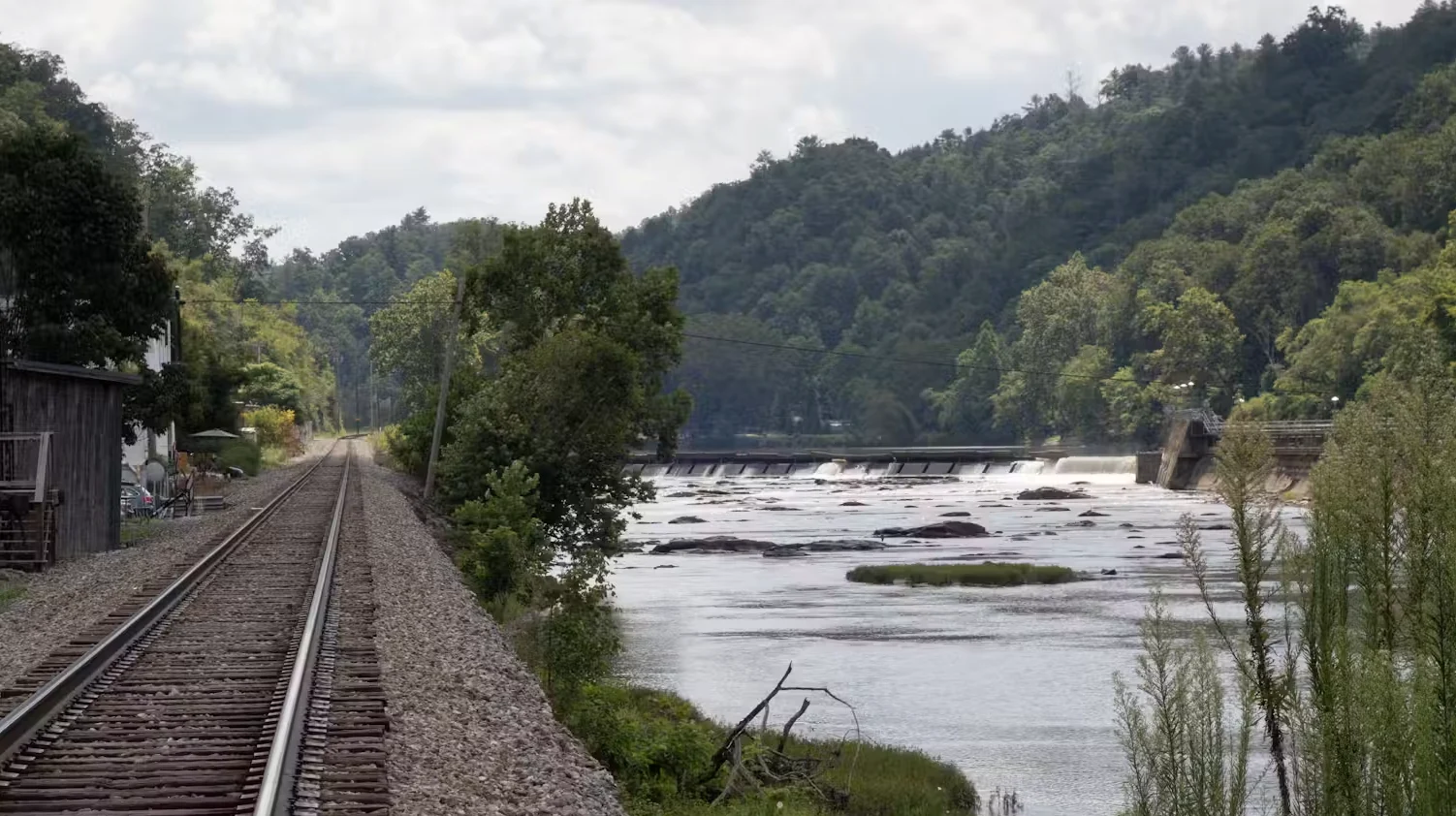 WIKIPEDIA: Often, small mountain towns have little available land between a river and the mountains. Here, the French Broad River flows near Marshall, N.C. Nicholas Hartmann via Wikimedia, CC BY