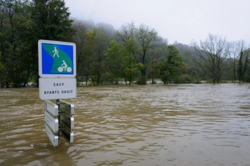 Residents of France climbed to their roofs as floodwaters reached a record level