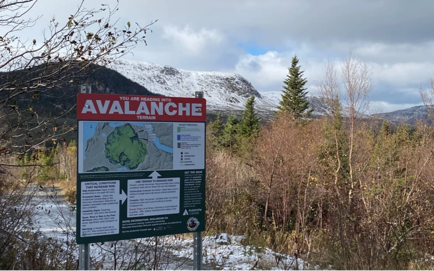 The field team has posted safety information at several avalanche-prone areas on Newfoundland's west coast, including this one at a trailhead in the Blow Me Down Mountains outside Corner Brook. (Submitted by Andy Nichols)