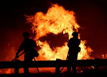 Fast-moving fires near Los Angeles force more than 40,000 to flee