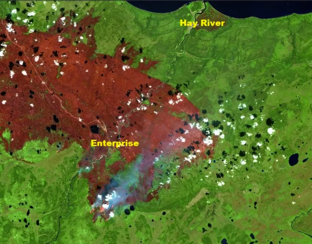 CBC: A satellite view on Aug. 20 of the wildfire that tore through the hamlet of Enterprise, N.W.T., and is threatening Hay River. (Sentinel-2/European Space Agency)
