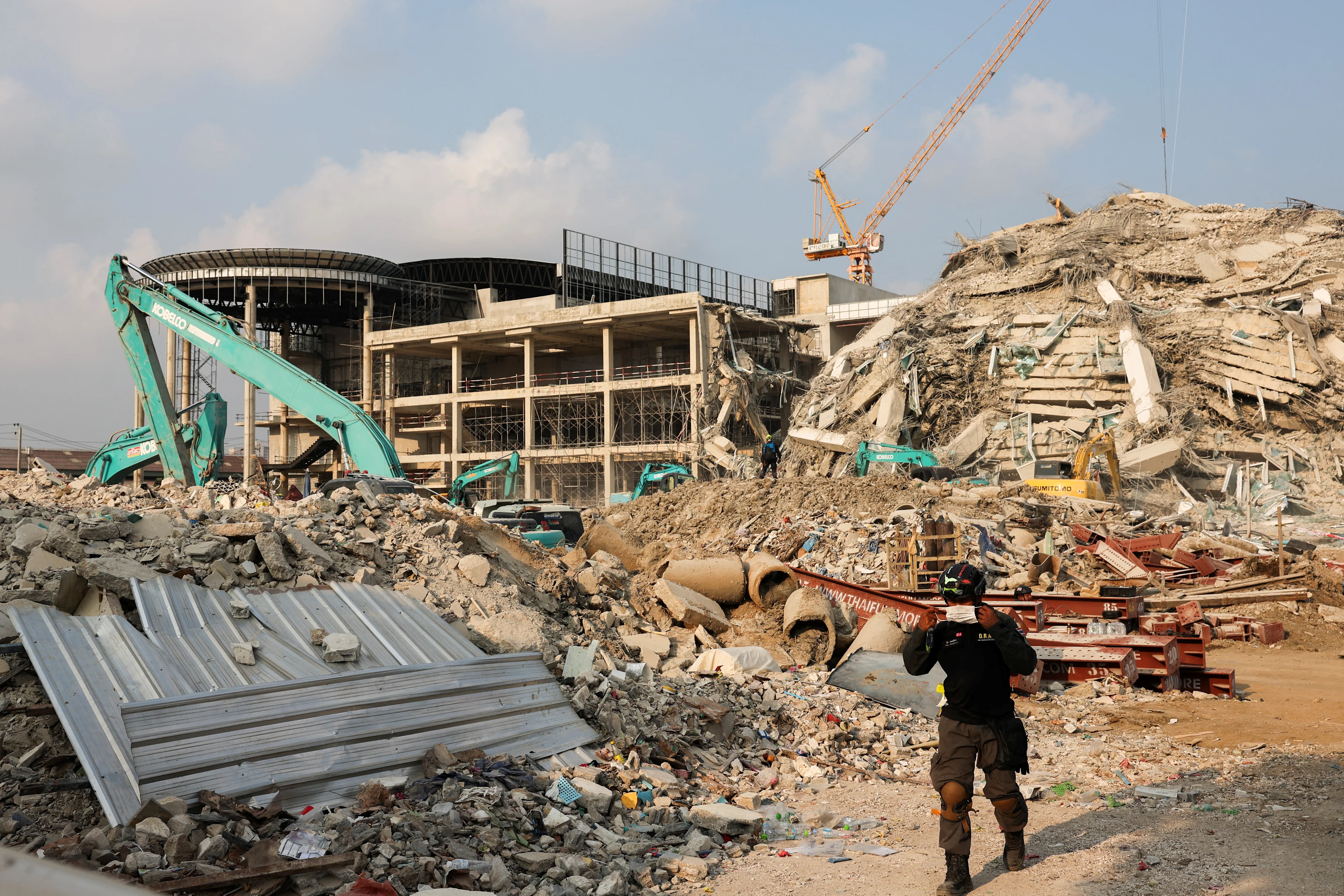 REUTERS: Rescue personnel work at the site of a building that collapsed, following a strong earthquake, in Bangkok, Thailand, March 29, 2025. REUTERS/Chalinee Thirasupa