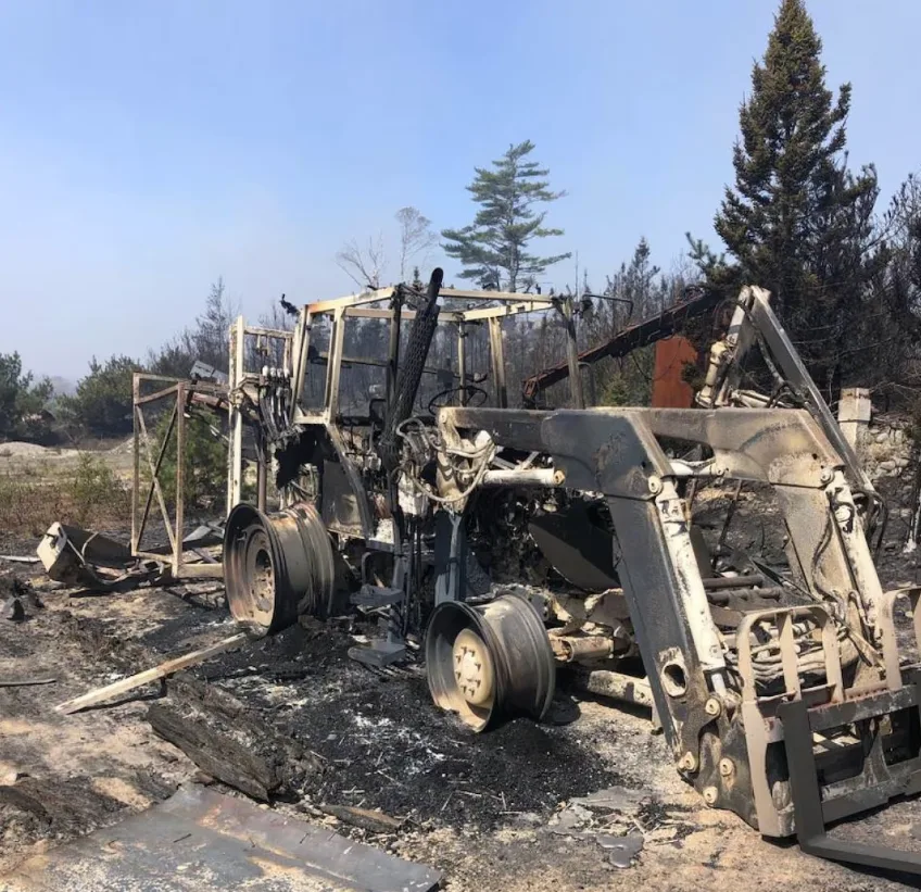 CBC: Blueberry grower Peter Sutherland lost his main harvester, two tractors, three out buildings, and a trailer full of extra parts he collected over 15 years to fire. (Submitted by Peter Sutherland)