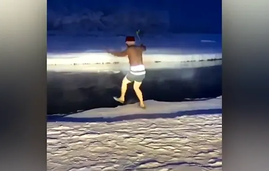 Man goes for a swim in the coldest village on Earth