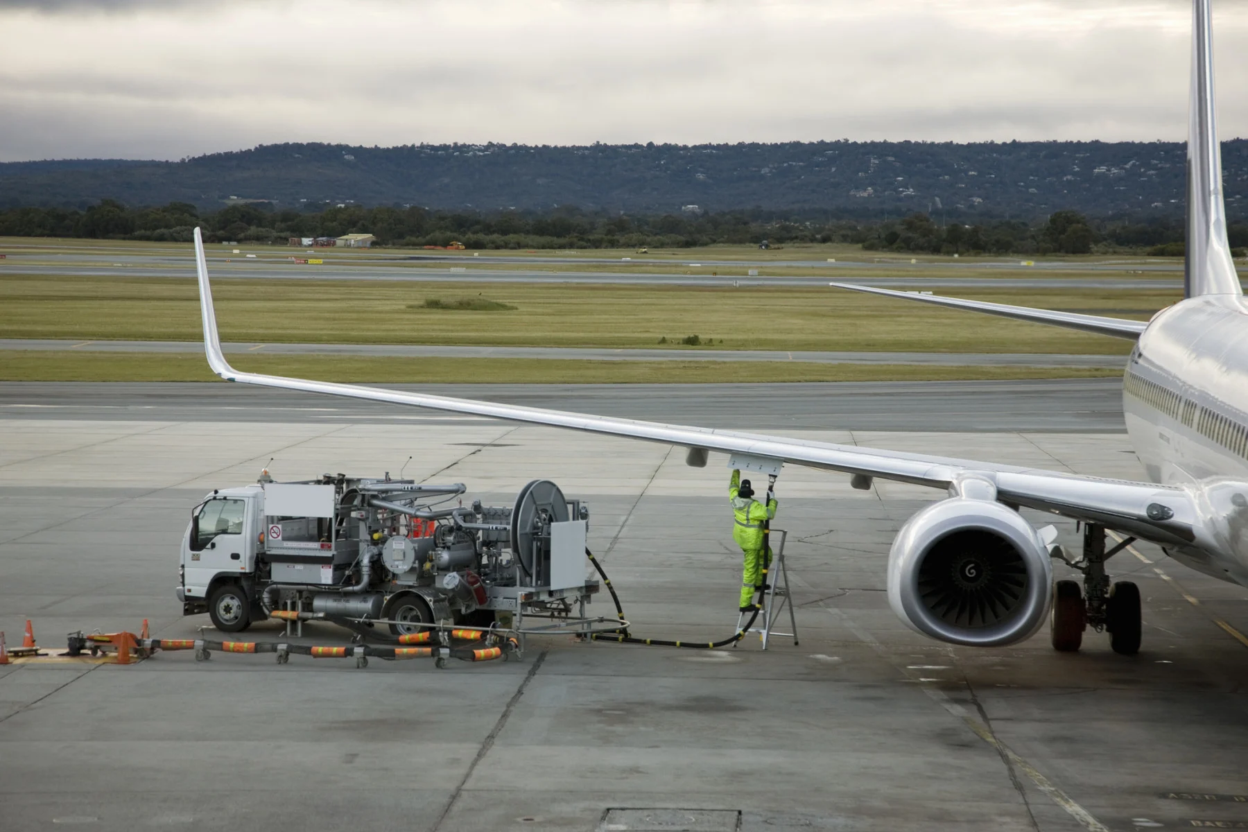 An airplane being refuelled on the tarmac. (Tobias Titz/ fStop/ Getty Images)