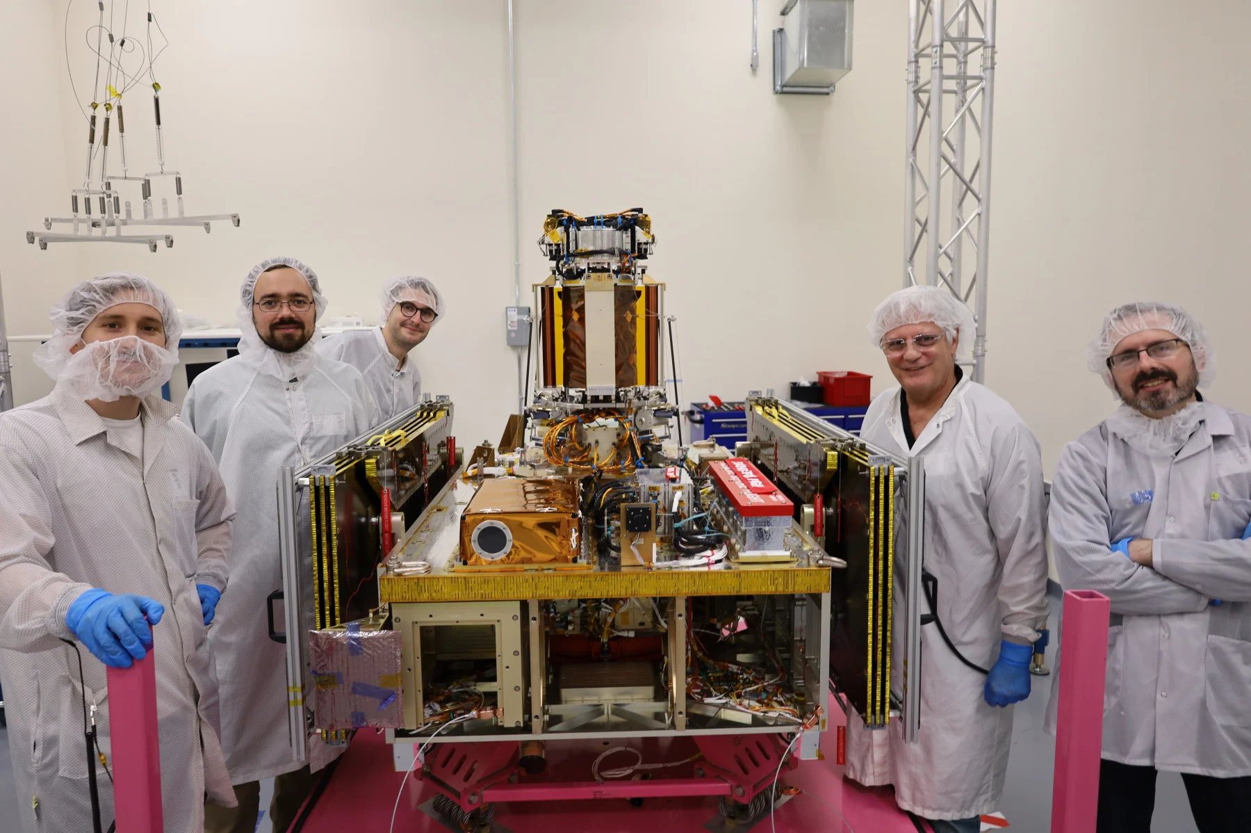 Scientists posing with the Momentus Vigoride spacecraft. (California Institute of Technology)