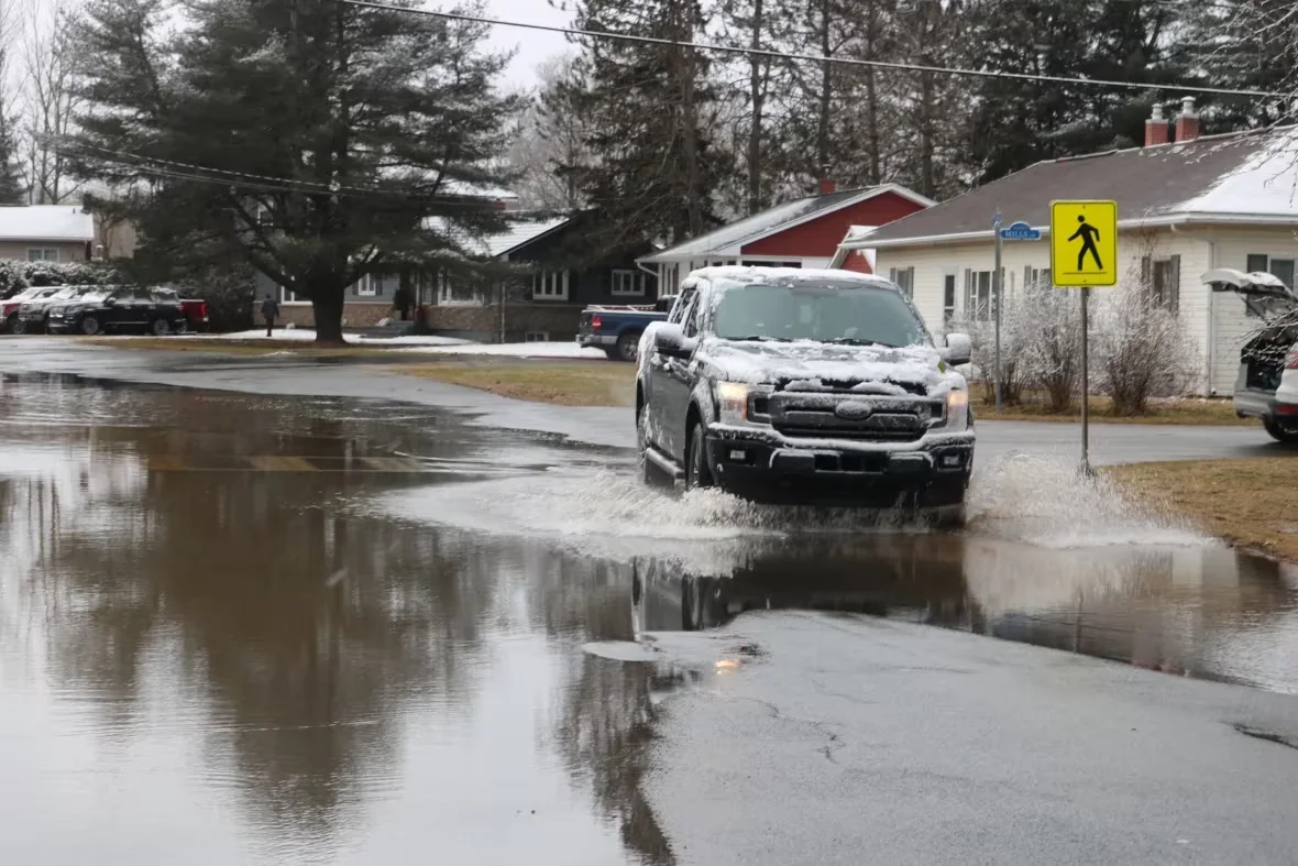 (CBC Julia Wright) Snow covered vehicle flooding Sussex N.B. February 29 2024