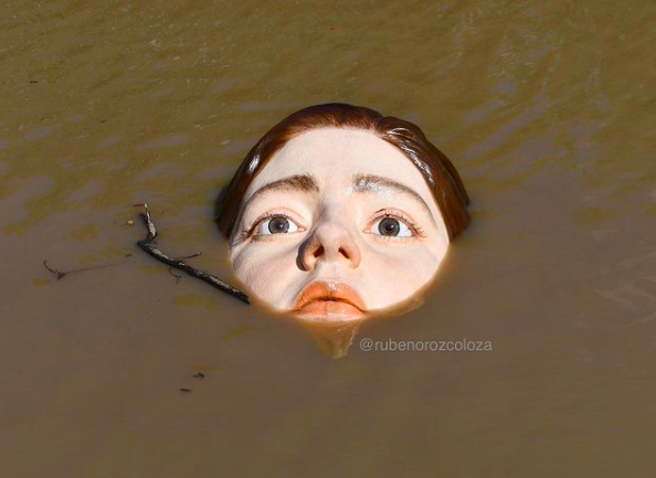 Eerie statue of a 'drowning' girl is a stark image of rising sea levels