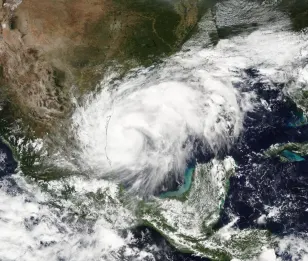 Francine upgraded to a hurricane bringing dangerous storm surge to Gulf Coast