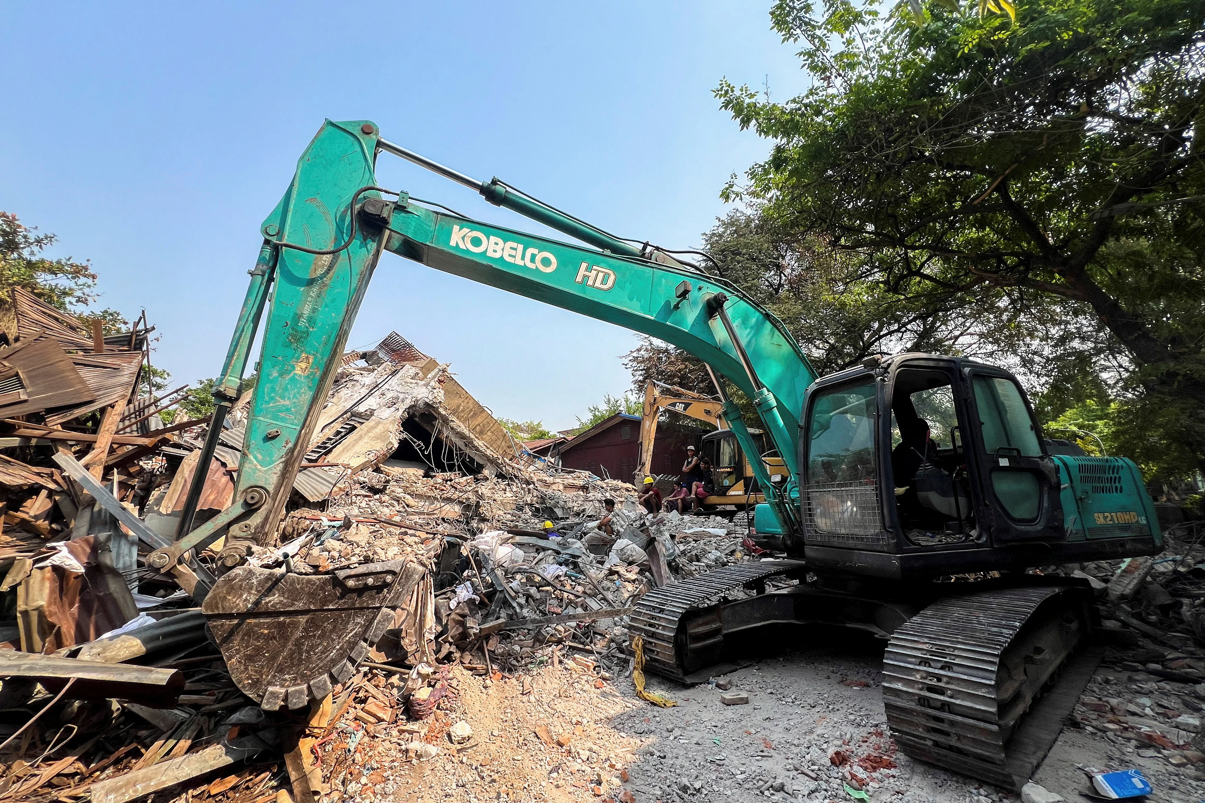 REUTERS: A person operates machinery following a strong earthquake, in Mandalay, Myanmar, March 31, 2025. REUTERS/Stringer