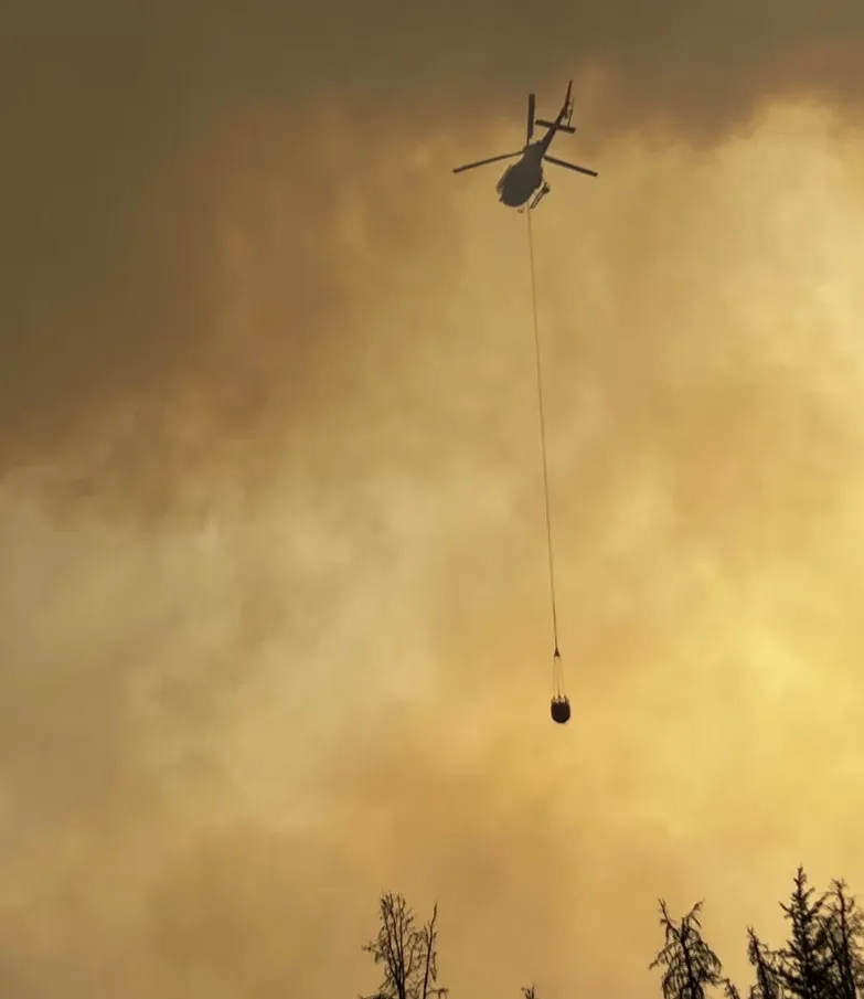 CBC: A helicopter involved in the firefighting effort in Jasper on Monday. (Submitted by Trina Pelland Taylor )