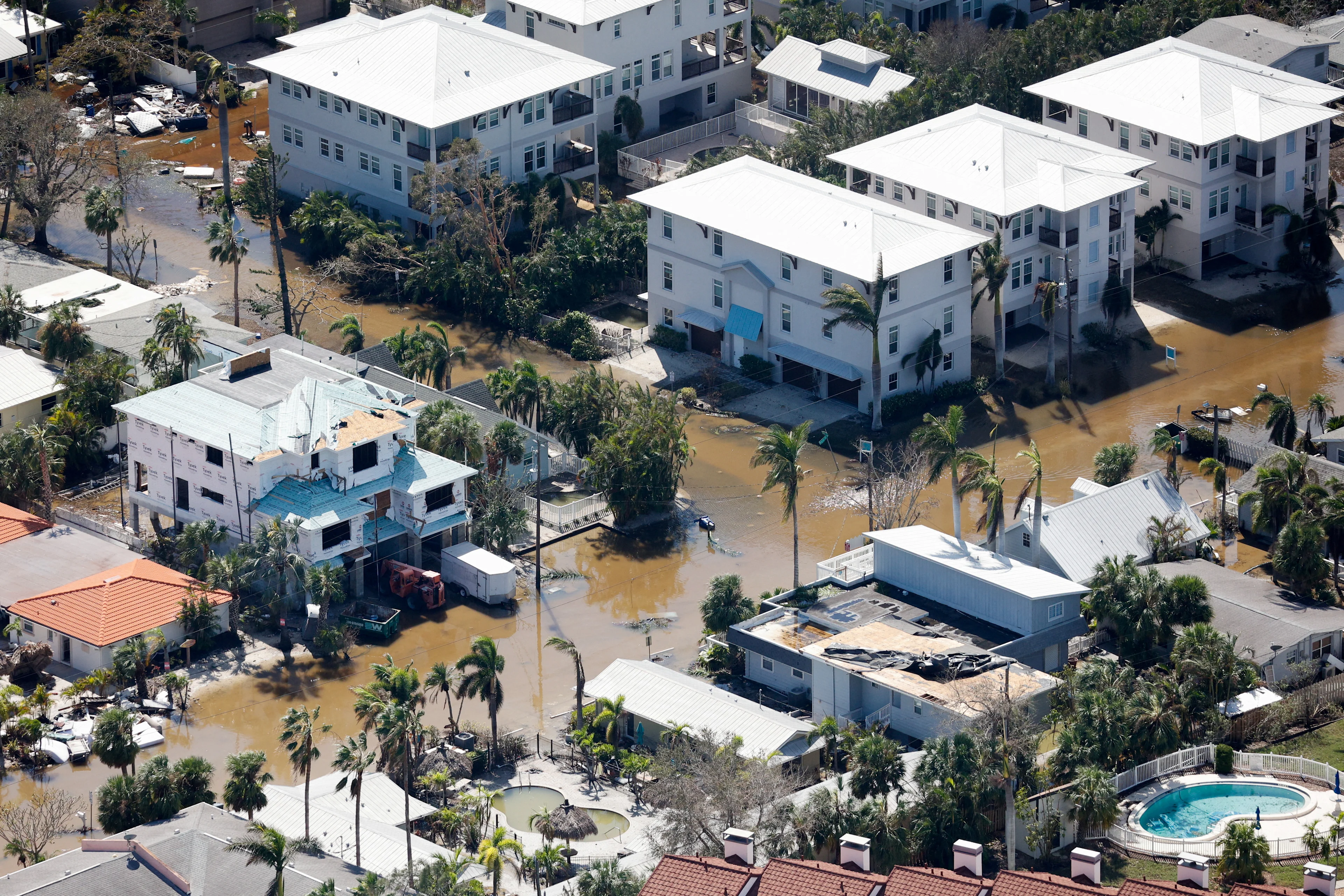 REUTERS: An aerial view shows streets flooded after Hurricane Milton's landfall, in Siesta Key, Florida, U.S., October 10, 2024. REUTERS/Marco Bello